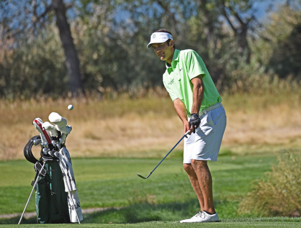 Dominic Kiefer looks on, following a chip shot. 
Photo Credit: Don Reichert of CSURAMS.com.