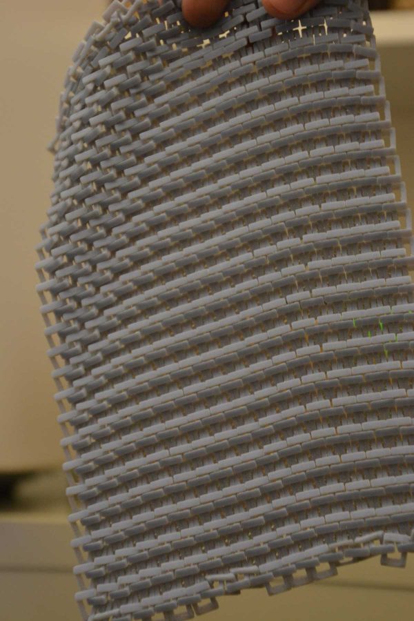 A sheet of chainmail created in the Idea-2-Product lab in Engineering. The chainmail is printed already linked together. (Photo Credit: Megan Fischer)