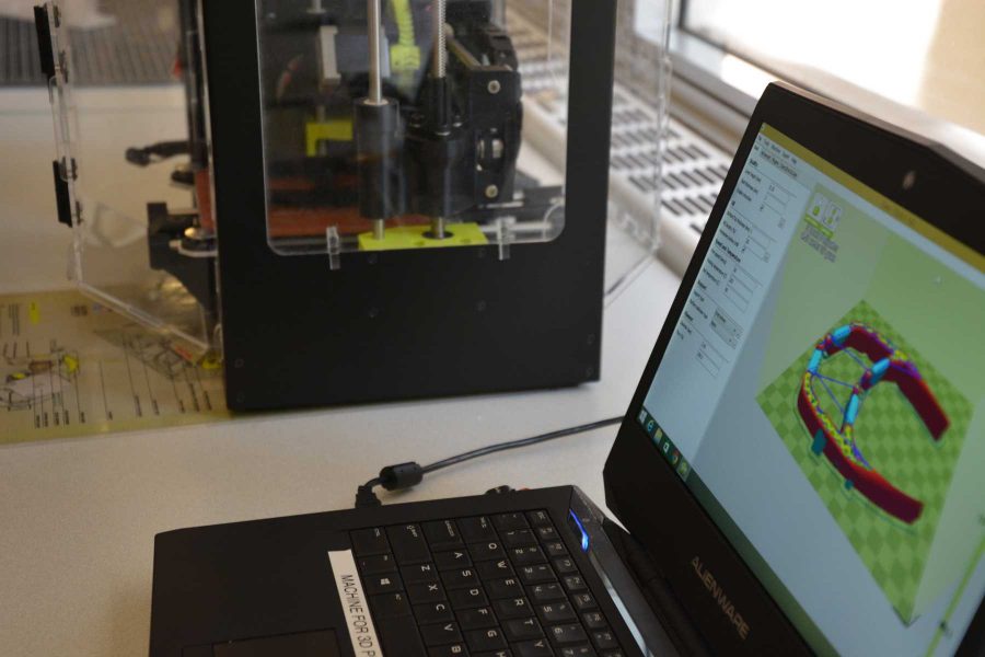 An object a student has created using software and a computer in the Morgan Library become a 3-D object. (Photo Credit: Megan Fischer)