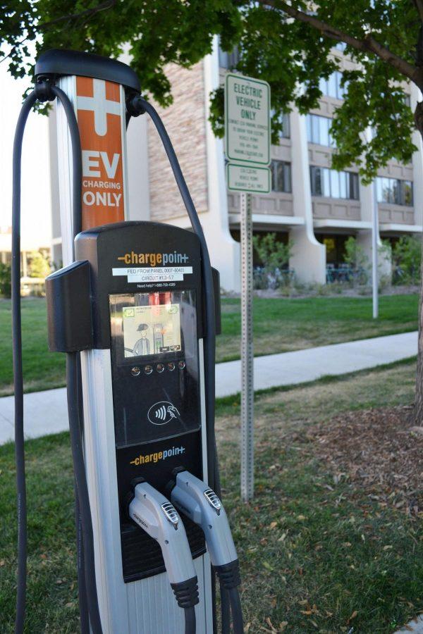 An electric vehicle between Durward and Alpine Hall is left unused on a sunny day. (Photo credit: Maria Nateris)