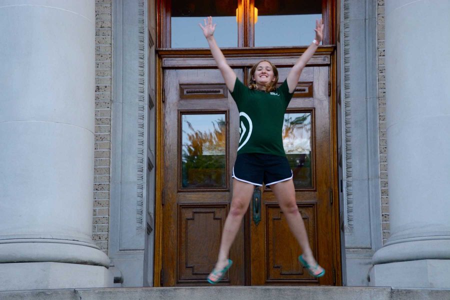 Senior international studies and economics major, Jenna Hamilton stands atop the steps of the administration building. Hamilton will graduate in May 2016 from the University. (Photo By: Megan Fsicher)