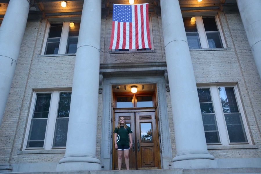 Senior international studies and economics major, Jenna Hamilton stands atop the steps of the administration building. Hamilton will graduate in May 2016 from the University. (Photo By: Megan Fsicher)