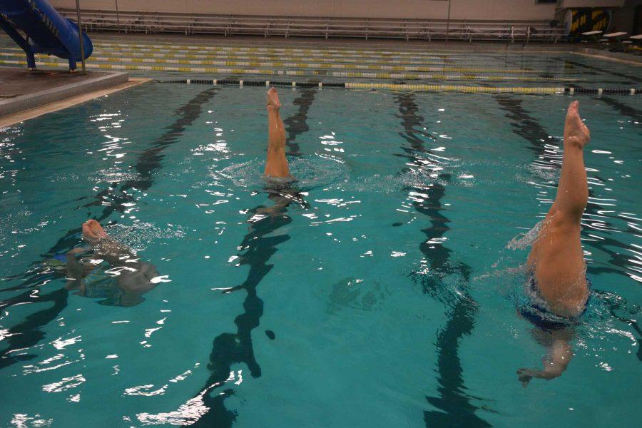 Members of the synchronized swimming team practice at the Dick-Hewson Acquatic Center in Loveland Monday after having their on-campus practices cancelled. (Photo Credit: Megan Fischer)