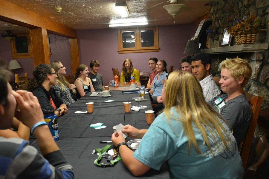 Students sit around a table in The Wild Boar Cafe to share their stories from their time abraod. Travel Tales, organized through the Office of International Programs, allows students to share in their love of travel with one another (Photo Credit: Megan Fischer)