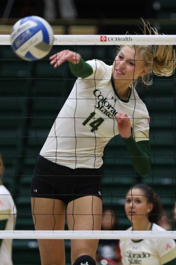 Alexandra Poletto finishes one of her four kills during CSU's sweep of UNC Tuesday. (Abbie Parr/Collegian)
