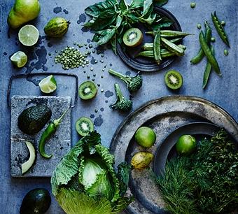 High angle view of green fruits and vegetables on plates