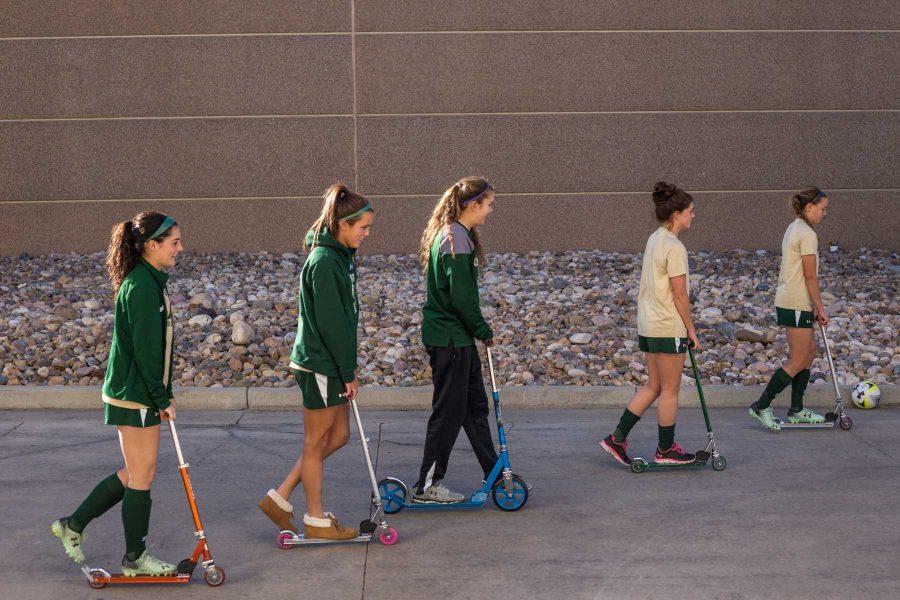 Left to right: Amy Eckert, Megan Speed, Jessica Jochheim, Erika Bratschun and Gianna Marconi ride their scooters after a CSU soccer practice. (Ryan Arb/Collegian)