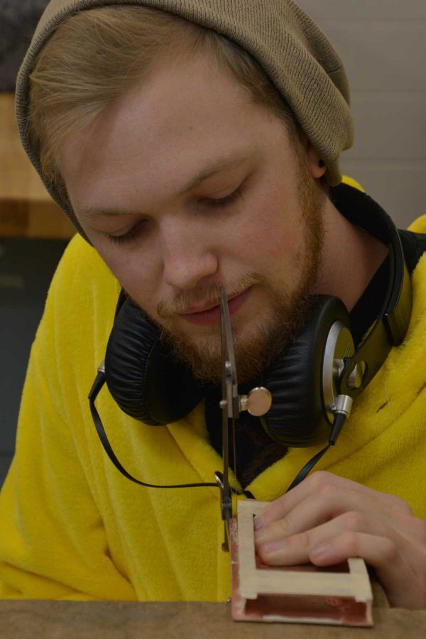 Senior art major, John Sullivan works on his next art piece in the Visual Arts Building lab. Sullivan is one of three Colorado State University finalists for the national NICHE Awards. Sullivans is a finalist for his piece, “Motherboard” in sculptural metal. (Photo Credit: Megan Fischer)