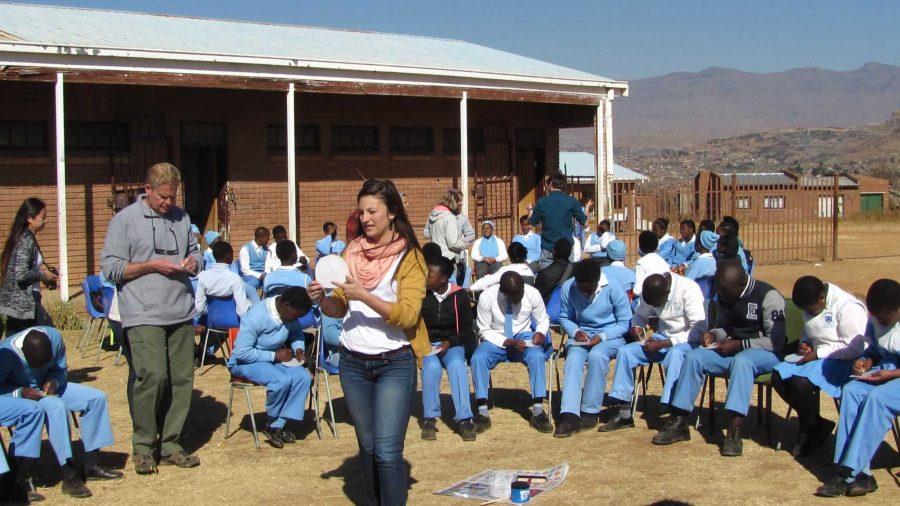 CSU student Jenna Lewis and Dr. Patrick Fahey work with other CSU students to bring art activities to school children in South Africa.