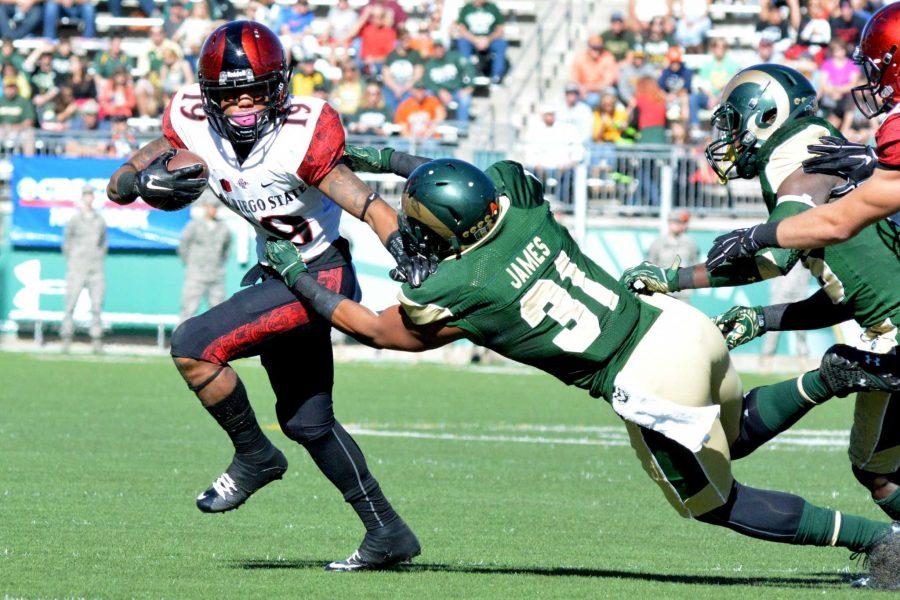 Colorado State linebacker Cory James brings down San Diego State running back Donnell Pumphrey in a game last season. (Christina Vessa/Collegian)