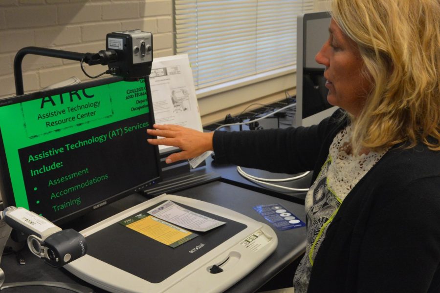 Marla Rolle, director of Assistive Technology Resource Center, demonstrates a piece of assistive technology called a video magnifier. The magnifier is used by visually impaired students to read small or far-away print 