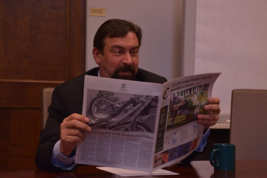 President Tony Frank reads a copy of the Collegian. (Photo Credit: Megan Fischer)