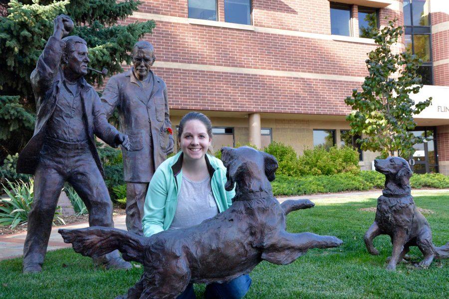 Tess Rychener, a first year veterinary student, sits outside the James L. Voss Veterinary Teaching Hospital. She hopes to work in an animal shelter some day. (Photo By: Megan Fischer)