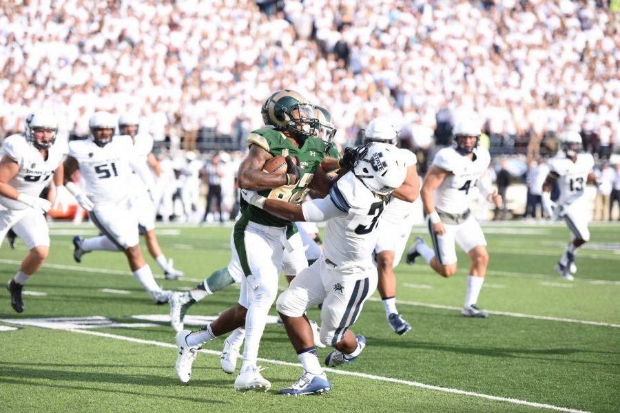 Colorado State reciver Rashard Higgins stiff arms a Utah State defender during Saturday's game at Maverik Stadium. (Photo Courtesy: The Utah Statesman)