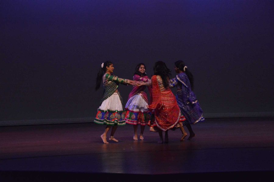 Students dance in bright clothing on at the Loncoln Center Saturday during India Nite, which is hosted by the India Student Association. The 3.5-hour long event incuded cultural and more modern dances from India, as well as music. (Photo Credit: Megan Fischer)