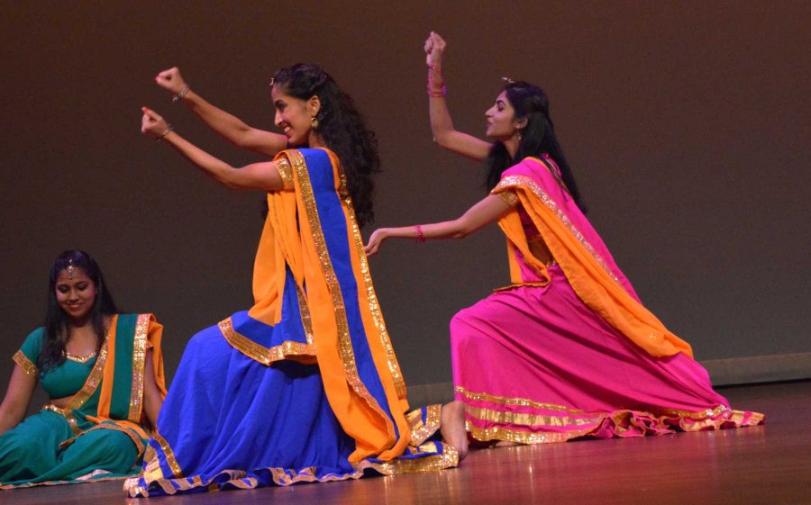 Students dance in bright clothing on at the Loncoln Center Saturday during India Nite, which is hosted by the India Student Association. The 3.5-hour long event incuded cultural and more modern dances from India, as well as music. (Photo Credit: Megan Fischer)