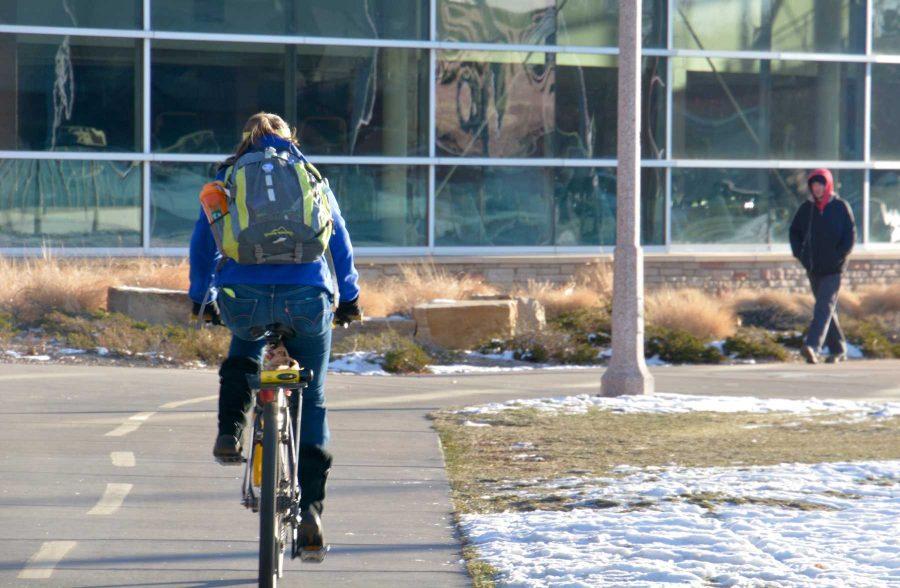 Bikers and pedistrians, like bikers and cars, share space around much of campus. With busy schedules and people rushing, accidents sometimes occur involving bicyclists. (Photo by: Megan Fischer)