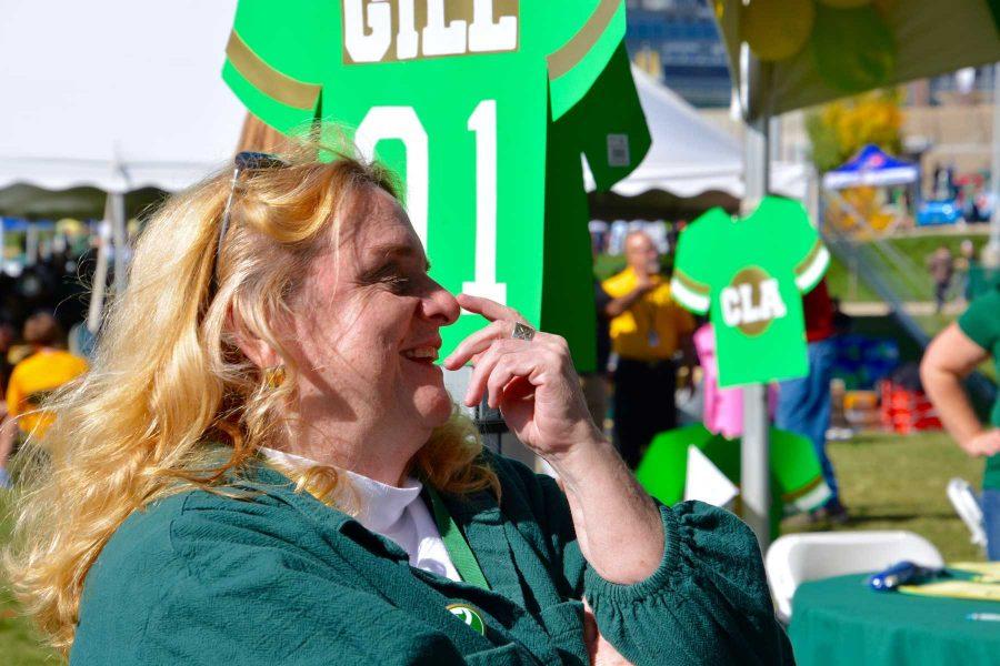 Dean Ann Gill reacts to a surprise at her retirement party, which was a part of the homecoming game tailgate. Some staff and faculty had created some cheers for her during the party. Gill will be retiring effective effective July 1, 2016, after nearly 36 years at Colorado State University. (Photo Credit: Megan Fischer)