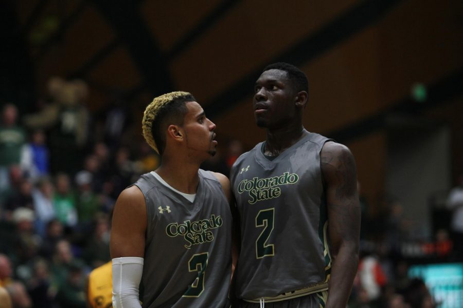 Former Colorado State players Gian Clavell, left, and Emmanuel Omogbo huddle up during the Rams' loss to Long Beach State Thursday night. (Kevin Olson/Collegian)