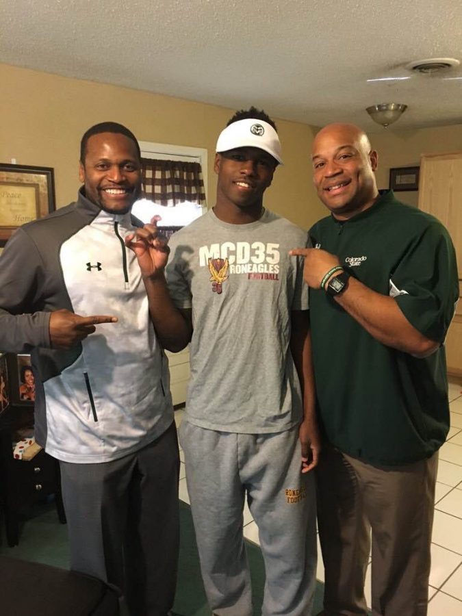 McDonogh 35 prep running back Darius May, center, committed to play for Colorado State Tuesday afternoon. (Photo Courtesy of Twitter/Darius May)