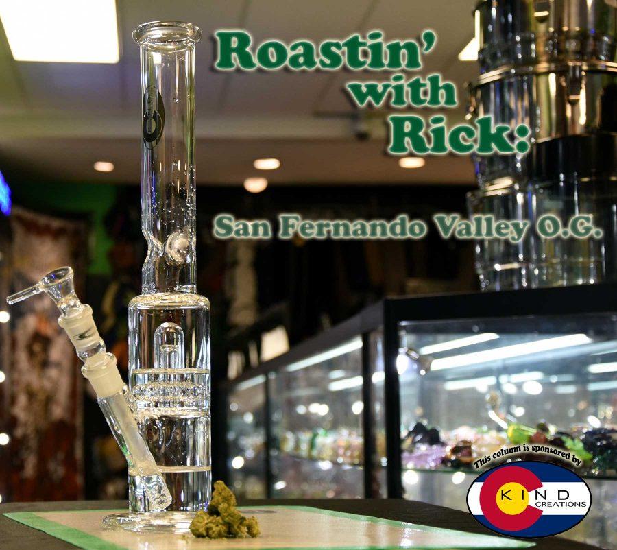 Kind Creations showerhead tube bong stands on top of Kind Creations non-stick mat next to a few buds of San Fernando Valley O.G.