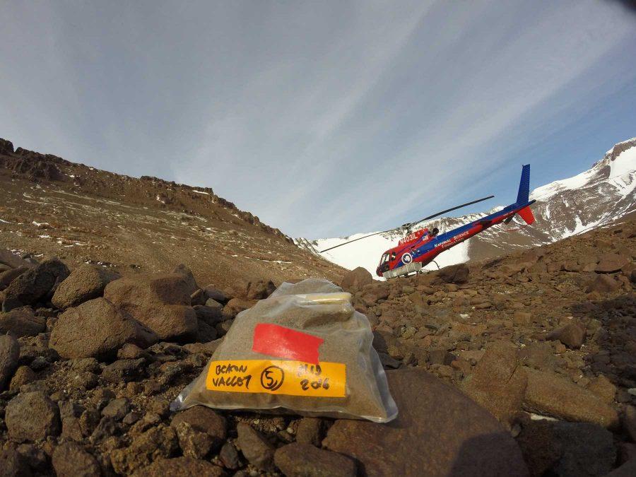 Diana Wall and her team of researchers comprising of graduate and post-doc students traveled to Antarctica in January to study the organisms in the soil. Pictured is a soil sample they team collected in Beacon Valley, Antarctica with a NSF A-Star Helicopter in background, which is how they have to get to their research site. (photo by: Ashley Shaw)