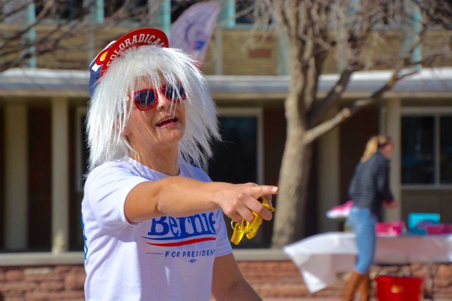 International Studies junior, Rachel Martel dances on the Colorado State University student plaza Wednesday. Martel was trying to encourage all whom walked by to vote. (Photo by: Megan Fischer)