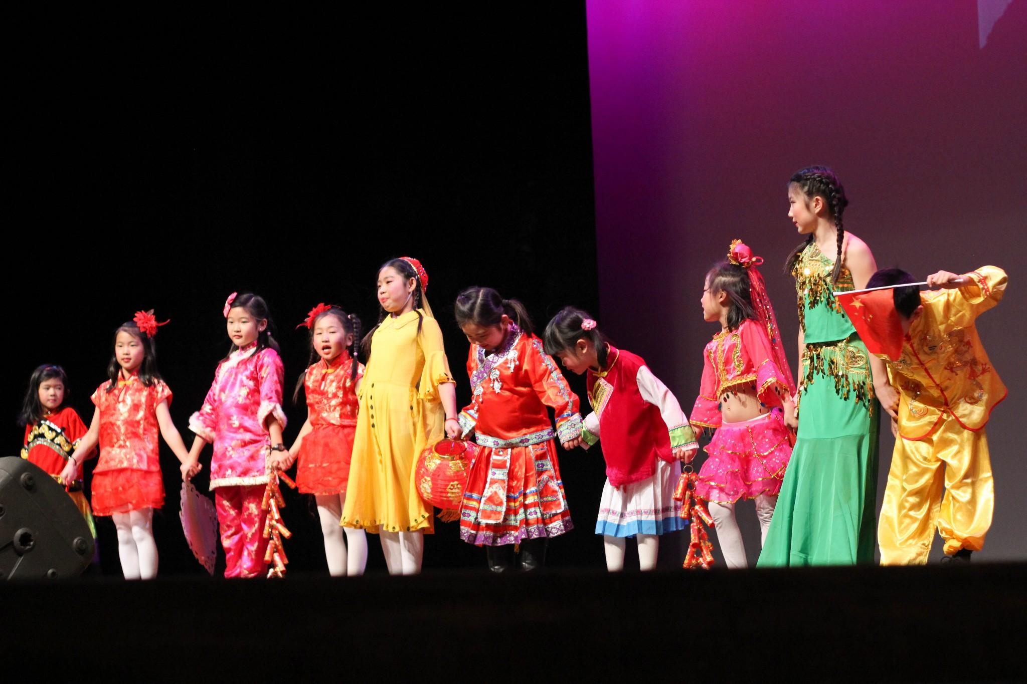 Students of the Hoaxing Chinese School display a variety of traditional Chinese clothing styles. The fashion show was a part of the Chinese New Year celebration at the Lincoln center Sunday evening. Photo by Jenna Fischer.