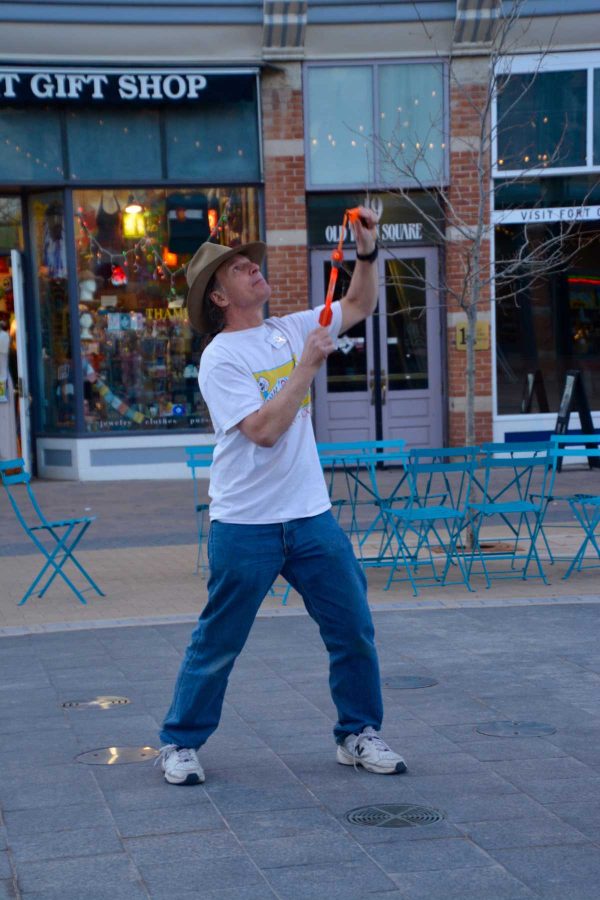 Matt Hanifin, owner of Science Toy Magic, shoots a rocket looking object made of foam into the air as he shows some of the products from his shop in Old Town, Fort Collins. (Photo Credit: Megan Fischer)
