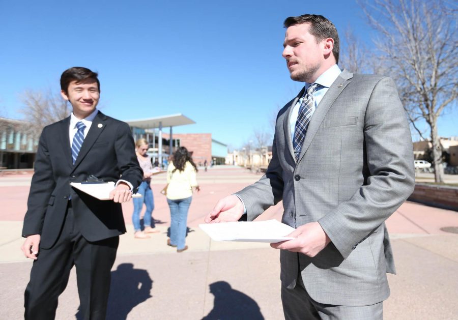 ASCSU director of community affairs, Edward Kendall (left), and ASCSU President Jason Sydoriak (right) encourage students on the Plaza to sign their petition to abolish the current U+2 law through the city of Fort Collins. Photo: Abbie Parr