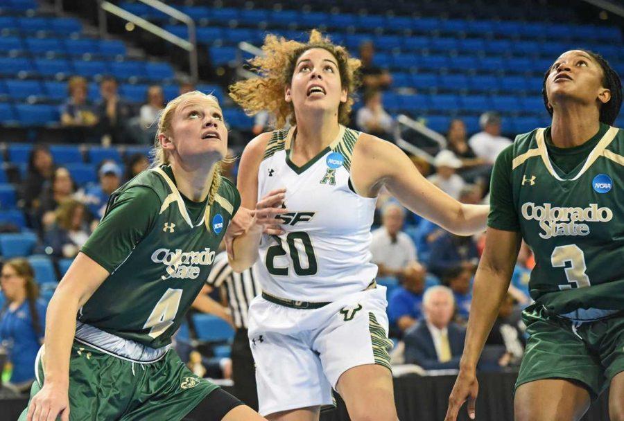 Emilie Hesseldal (left) and Keyora Wharry (right) get ready to position themselves for a rebound against USFs Laura Ferreira (middle). (Photo courtesy of CSU Athletics)