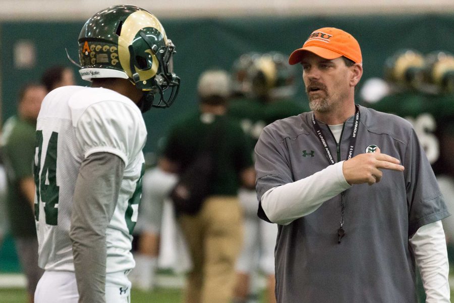 Wide receiver Xavier Williams (left) works with CSU coach Mike Bobo during a spring practice. (Luke Walker/ The Collegian)