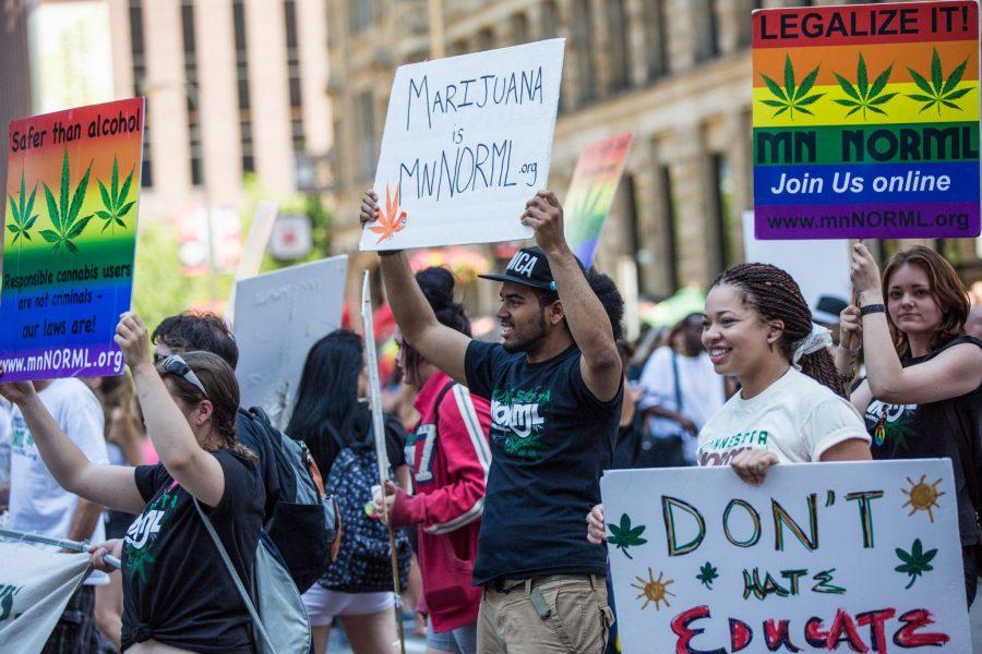 People at the Twin Cities Pride Parade supporting marijuana legalization (Photo Credit: Wikipedia).