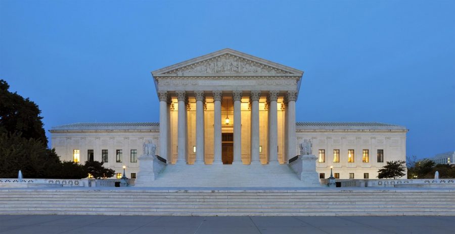 Panorama of the west facade of United States Supreme Court Building at dusk in Washington, D.C., USA (Photo Credit: Joe Ravi, Wikimedia Commons).
