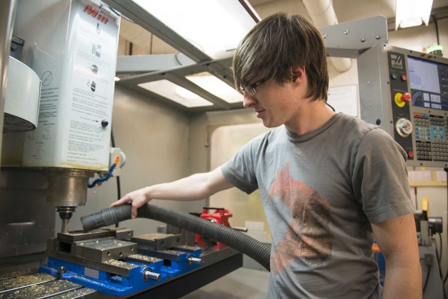 Kasey Kuhnel a senior in mechanical engineering student works on a part in one of the CNC machines in the Engineering Manufacturing Education Center (EMEC) for the EcoCAR senior design project. (Luke Walker/ The Collegian)