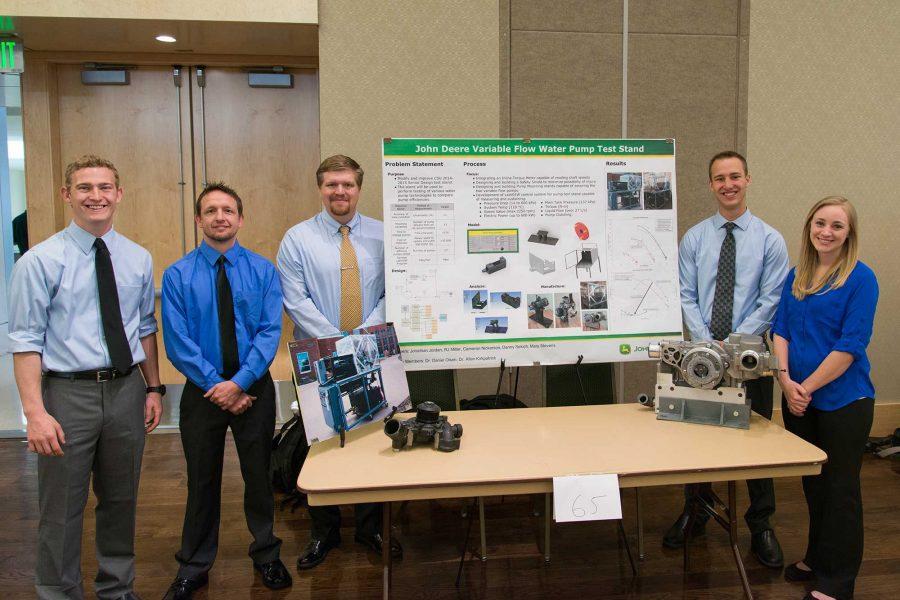 Members of the John Deere senior design team show off their poster at E-days 2016 in the Lory Student Center (Luke Walker/ The Collegian)