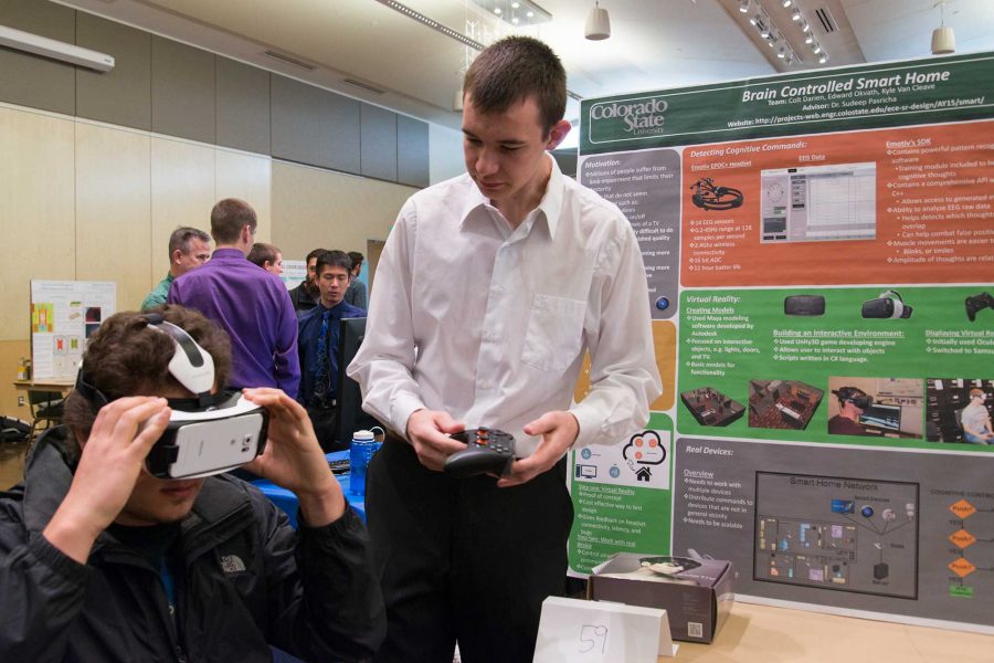 Colt Darien demonstrates a virtual reality headset as part of his senior design project: Brain Controlled Smart Home at E-Days 2016 in the Lory Student Center (Luke Walker/ The Collegian)