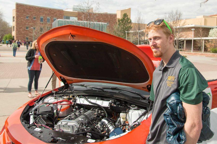 Matt Bulow discusses the Eco Car senior design project he has been working on at E-Days 2016 outside the Lory Student Center (Luke Walker/ The Collegian)