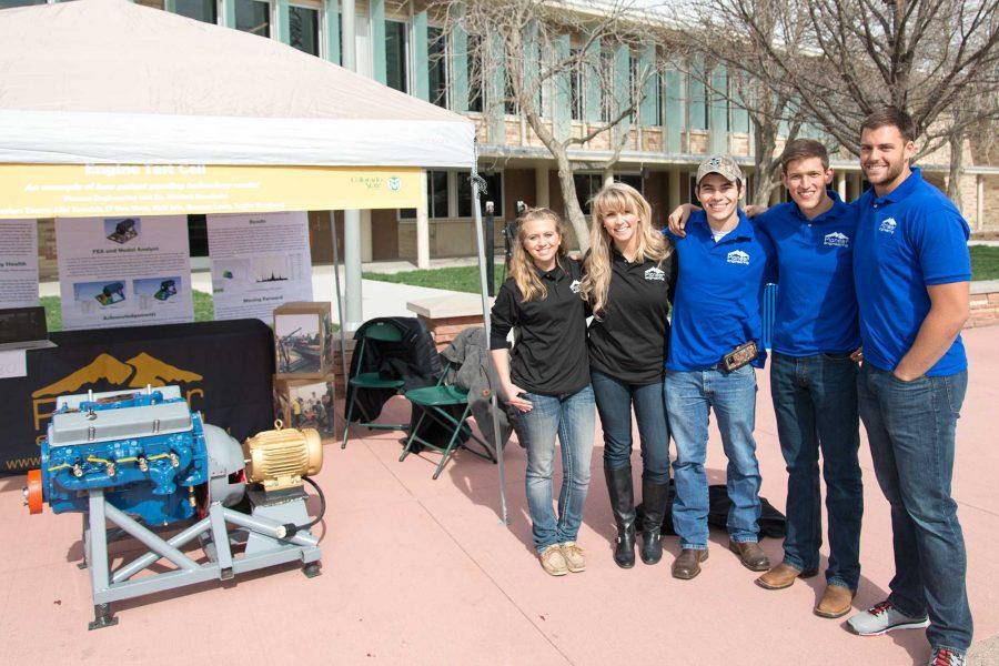 Members of the Pioneer Engineering senior design team stand beside their booth at E-Days 2016 outside the Lory Student Center (Luke Walker/ The Collegian)