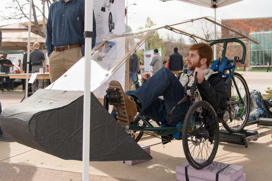 Brett Goldfarb shows off the Human Powered Vehicle senior design project at E-Days 2016 outside the Lory Student Center (Luke Walker/ The Collegian)