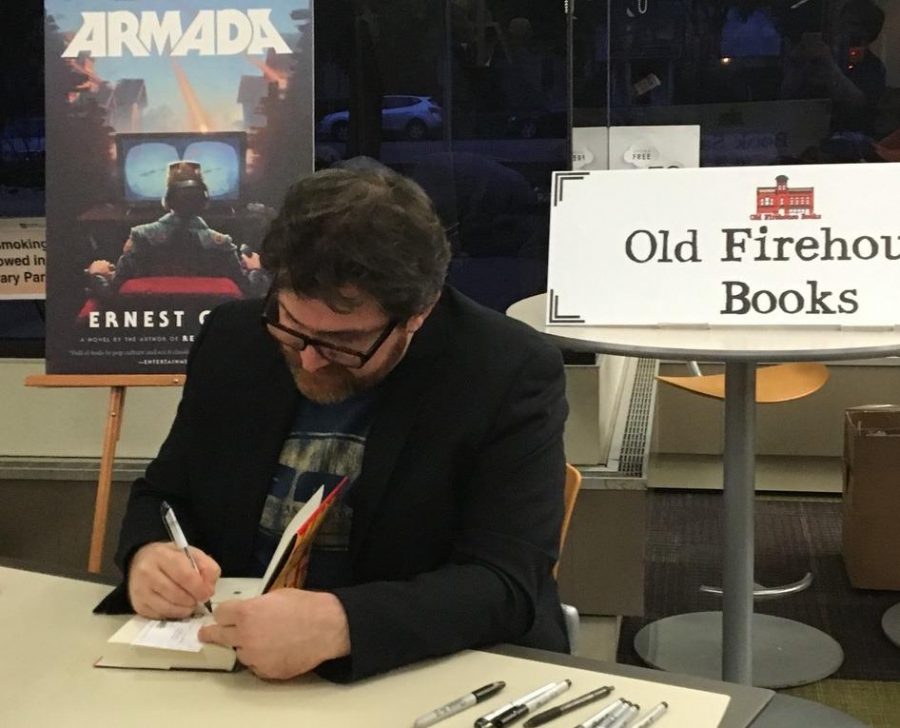 Author Ernest Cline signed copies of his books after his book talk at Old Town Library. (Photo credit Seth Bodine)