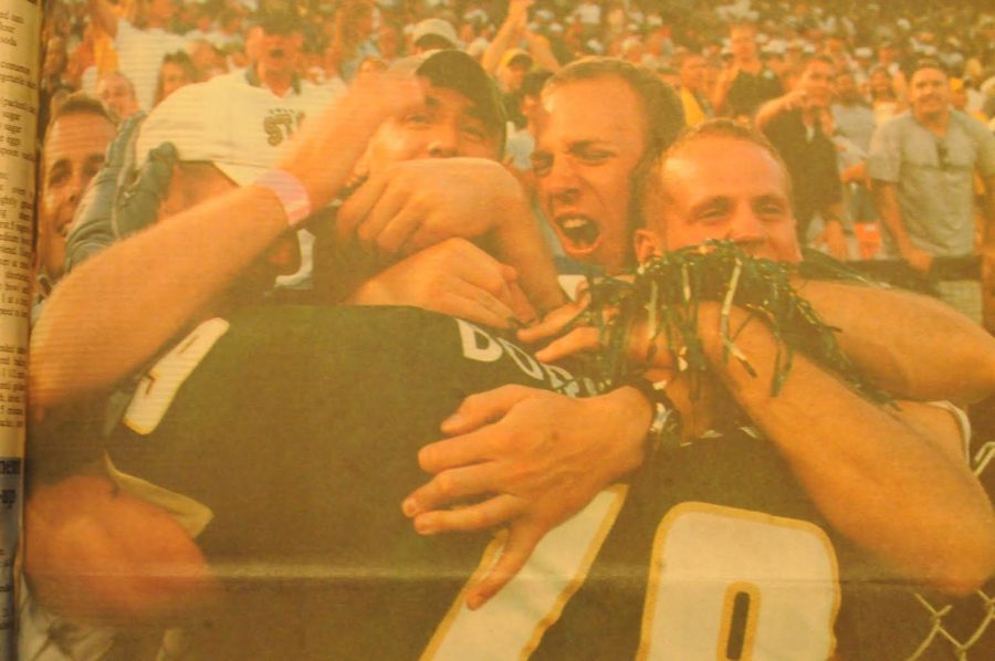Offensive lineman Justin Borvansky celebrating the 2000 Showdown win Photo credit: Keegan Pope