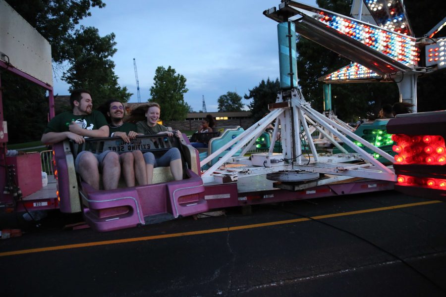 Colorado State University freshman (class of 2020) hold on tight while riding a carnival ride during the first night of Ram Welcome activities on Thursday, August 18. The Ram Welcome weekend featured carnival rides, games, music, and many other activities for incoming CSU freshman to participate in during their first week at Colorado State University. (Forrest Czarnecki | Collegian)