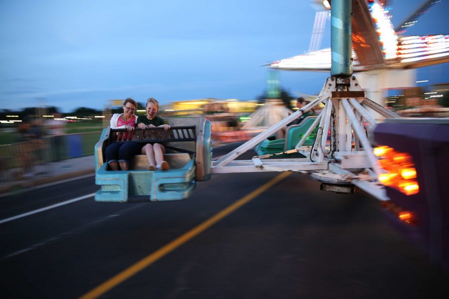 Ram Welcome 2016: Two students take a spin on a ride at the Ram Welcome Carnival. The carnival, a traditional activity, is held on the Intramural Fields.