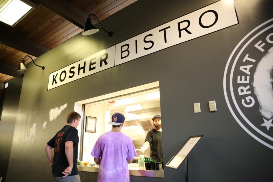 Colorado State University students get dinner from the newly opened Kosher Bistro on Monday night. The Kosher Bistro is located in the Parmelee dining hall and offers all types of food for students. All of the food served is certified Kosher. Photo credit: Forrest Czarnecki