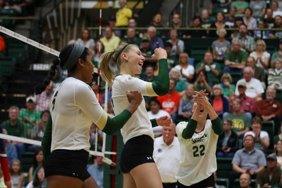 Junior Alexandra Poletto celebrates her block with fellow teammates. (Elliott Jerge | Collegian) Photo credit: Elliott Jerge