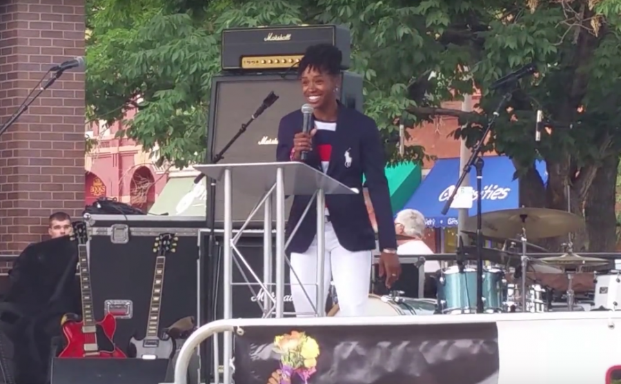 Janay DeLoach wears the official Olympic Opening Ceremonies attire while speaking in Old Town. (Erik Petrovich | Collegian)