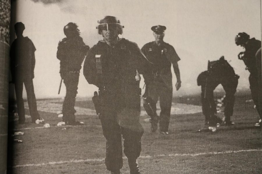 Police officers walk on the field after the 1999 Rocky Mountain Showdown Photo credit: Keegan Pope