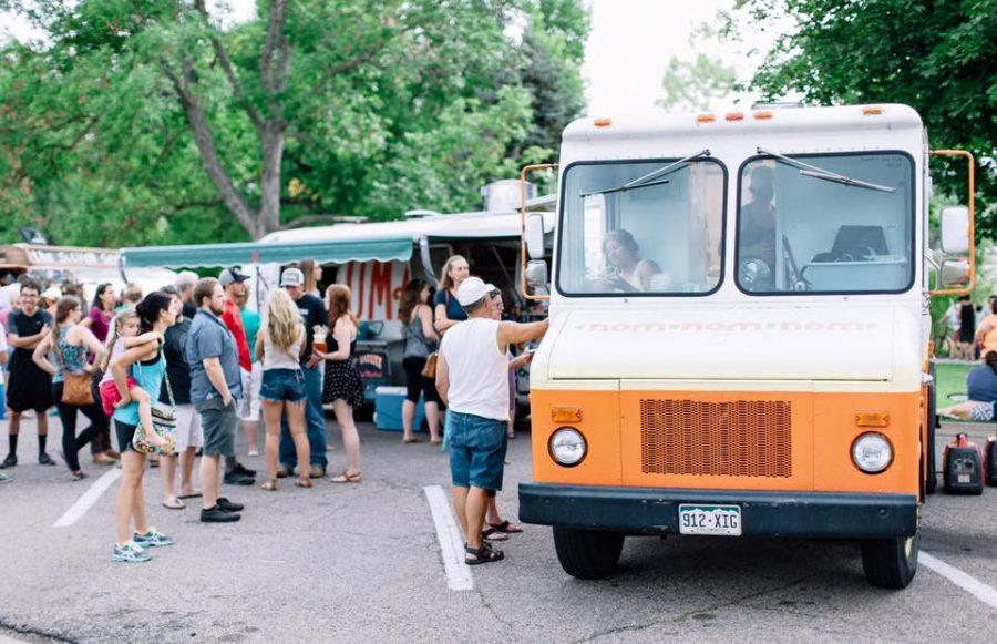 Fort Collins community members enjoy dinner at the City Park Food Truck Rally. Photo courtesy of McKenzie Coyle