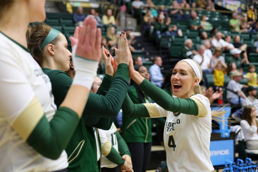 Colorado State University's McKenna Thornlow celebrates with the volleyball team after the Rams score against Fresno State on Thursday night at Moby arena. The Rams beat the Bulldogs in 4 sets.